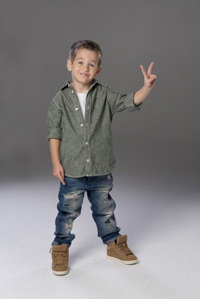 Happy boy showing victory sign - Photo, Image