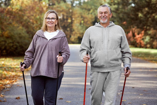 Senior caucasian couple hiking together at the park  - Photo, Image