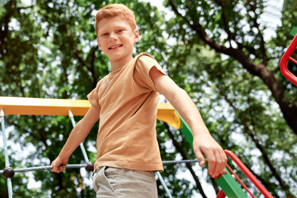 Portrait of ginger boy at the playground  - Foto, imagen