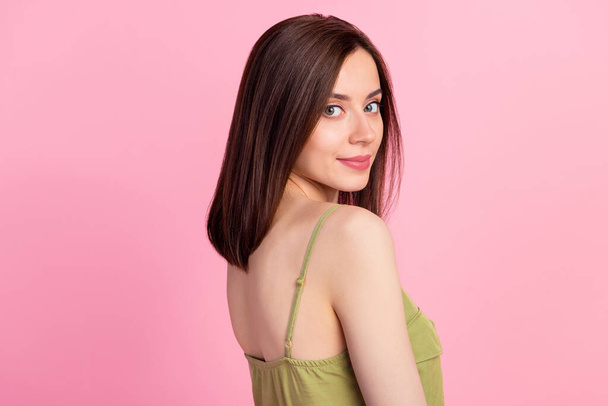 Profile photo of attractive gorgeous woman with brunette hairdo dressed khaki tank looking at camera isolated on pink color background. - Fotografie, Obrázek