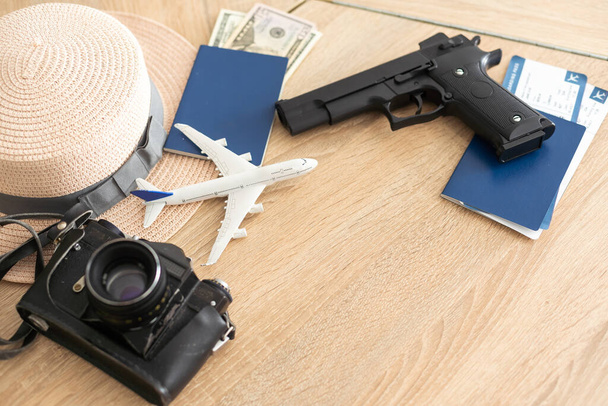 passport, tickets, toy plane, gun. Travel ideas - Foto, imagen