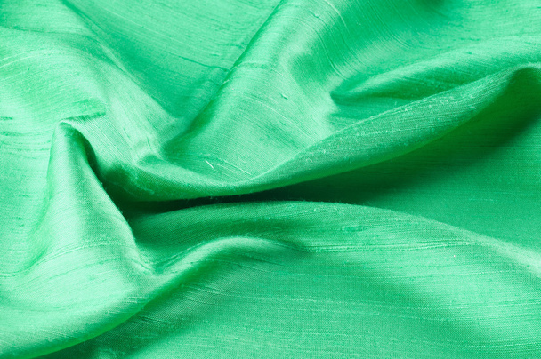 Textur Spitze. ein feines offenes Gewebe, typischerweise aus Baumwolle oder Seide, das durch Schlaufen, Zwirnen oder Stricken von Fäden in Mustern hergestellt und speziell zum Zuschneiden von Kleidungsstücken verwendet wird. - Foto, Bild