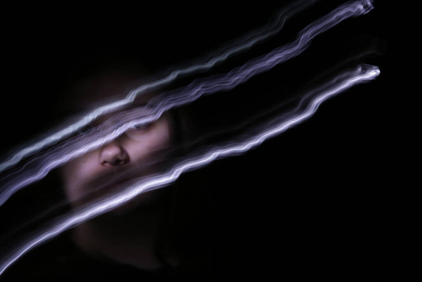 plus size woman with long exposure light trails in front of face  - Fotoğraf, Görsel
