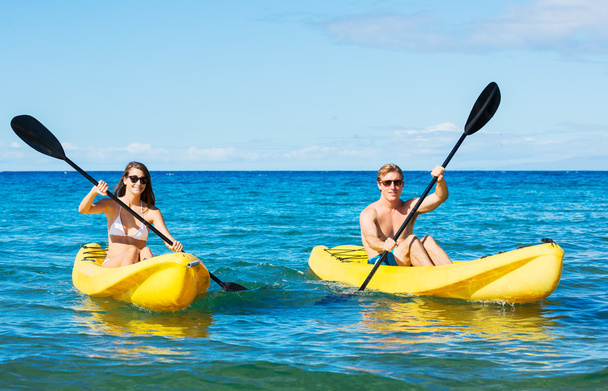 Man and Woman Kayaking in the Ocean - Фото, изображение