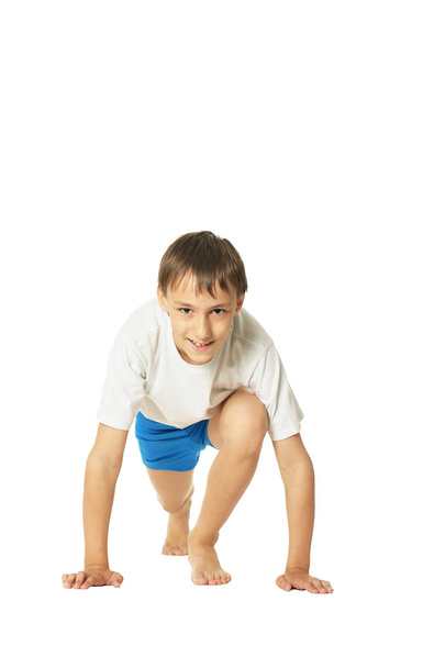 Young boy doing exercises - Valokuva, kuva