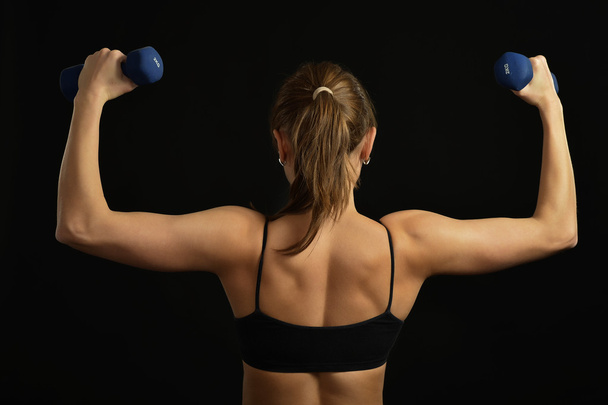 Woman workout  with dumbbells - Fotó, kép