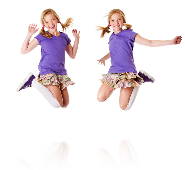 Happy identical twins jumping and laughing - Foto, afbeelding
