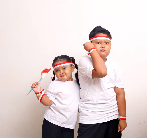 Indonesian kids celebrate independence day. Isolated on white background - Valokuva, kuva