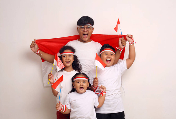 Indonesian kids celebrate independence day. Isolated on white background - 写真・画像