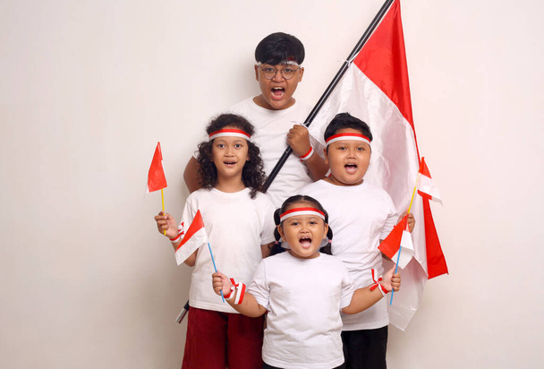 Indonesian kids celebrate independence day. Isolated on white background - Photo, Image