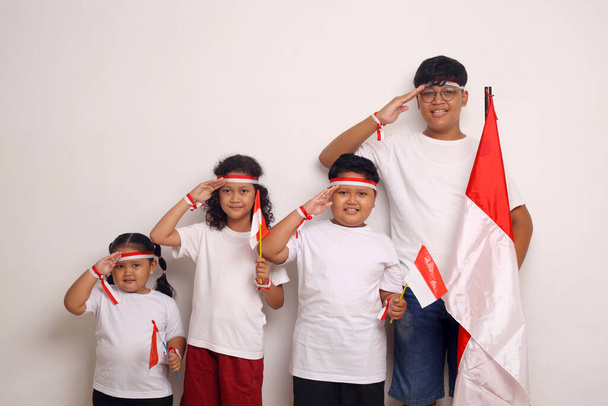 Indonesian kids celebrate independence day. Isolated on white background - Foto, imagen