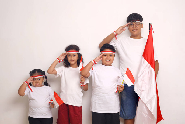Indonesian kids celebrate independence day. Isolated on white background - Foto, imagen