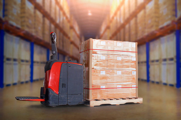 Electric Forklift Pallet Jack with Packaging Boxes Stacked on Pallet in Storage Warehouse. Cargo Shipping. Warehouse. Inventory Management. Tall Shelf Storage. Supplies Warehouse Logistics. - Photo, image