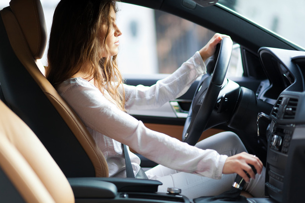 Young woman driving her car - Фото, зображення