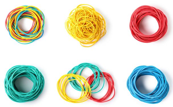 Collage of colorful elastic bands on white background, top view - Foto, imagen