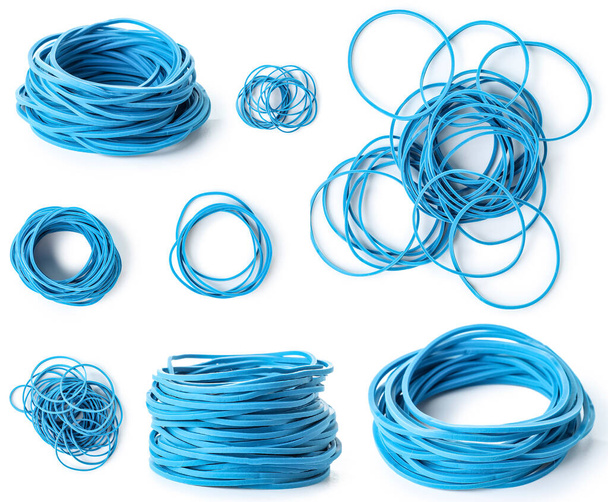 Collage of blue elastic bands on white background - Foto, imagen