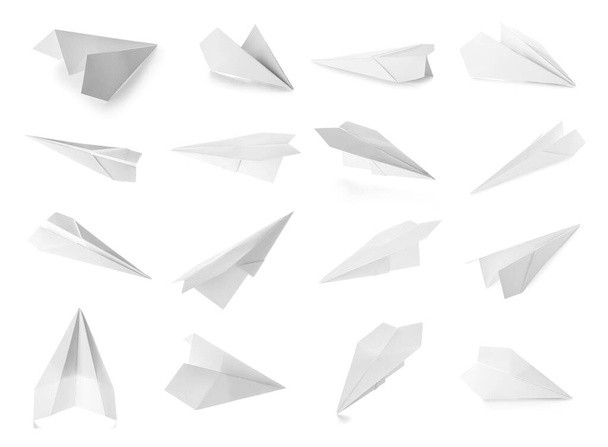 白い背景の上に紙飛行機を設定します。 - 写真・画像