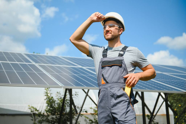 Worker installing solar panels outdoors. - Fotografie, Obrázek