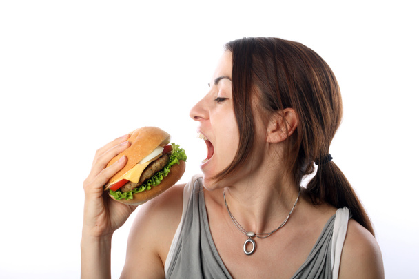 Женщина ест гамбургер
 - Фото, изображение