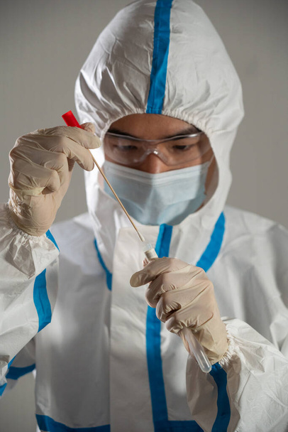 Medical personnel performing an antigen test for covid-19. - Φωτογραφία, εικόνα