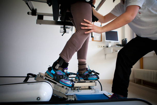 Gait training by robotic assistance to facilitate rehabilitation exercises. - Photo, Image