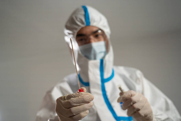 Medical personnel performing an antigen test for covid-19. - Fotoğraf, Görsel