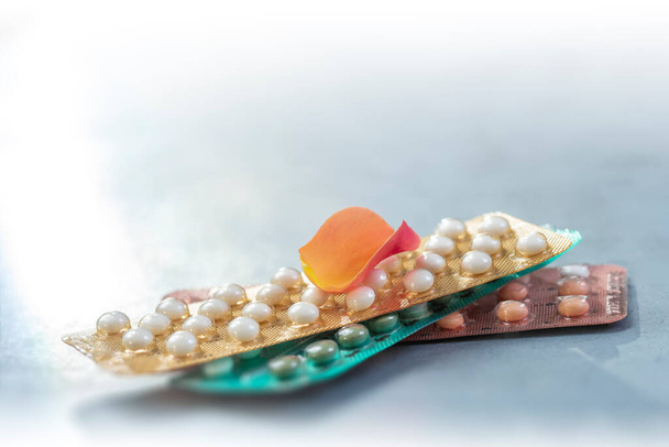 Colorful oral contraceptive pill strips isolated on grey. - 写真・画像