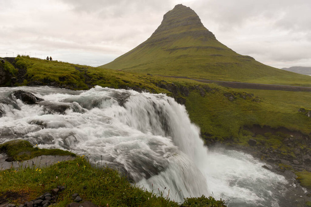 View at mount and waterfall of Kirkjufell at Grundarfjordur on Iceland - Photo, image