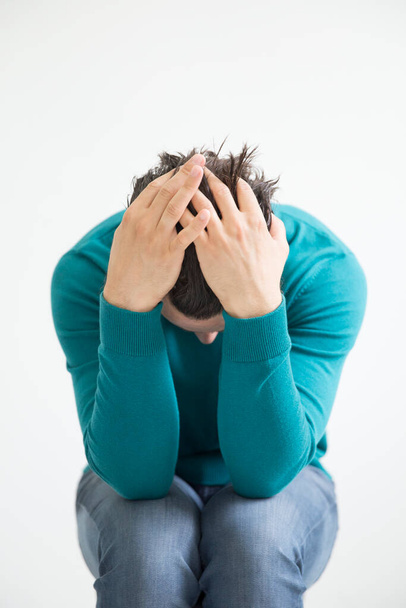 Depressed man on studio background - Fotó, kép