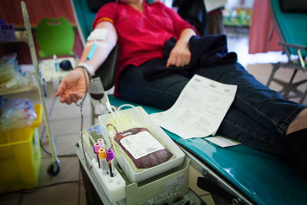 Blood donor in a blood collection facility. - Foto, imagen