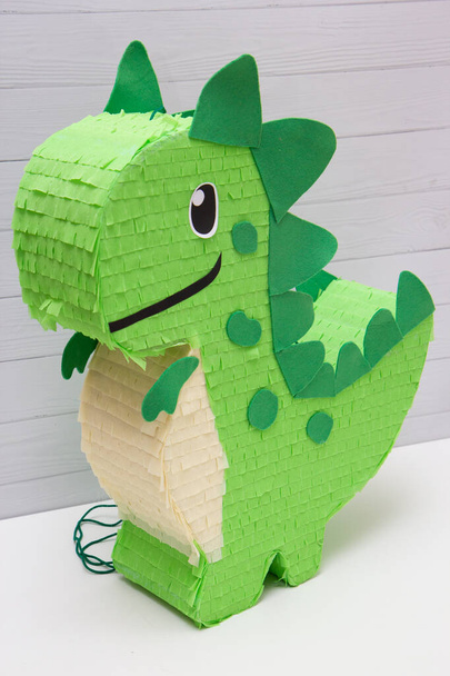 pinata toy green dinosaur on a white background - Foto, Imagen