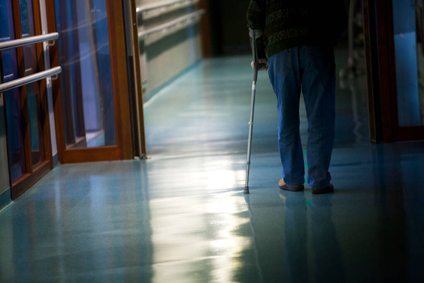 Elderly man with his cane in a hallway of a retirement home. - Foto, Imagem