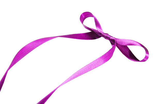 Violet ribbon and bow. Isolated on the white background - Fotografie, Obrázek