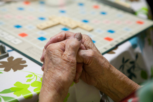 Elderly person playing in a retirement home. - Photo, Image