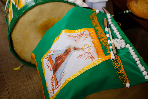 banner with image of Our Lady Aparecida and musical instrument percursive box - 写真・画像