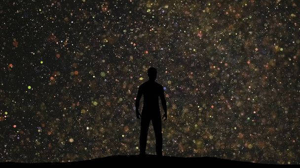 The man stands on a beautiful starry sky background - Foto, afbeelding