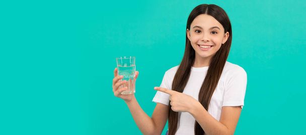 stay hydrated. kid hold glass of mineral water. child feel thirsty. Banner of child girl with glass of water, studio portrait with copy space - Foto, Imagem