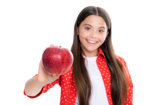 Fresh fruit. Teenager girl hold apples on white isolated studio background. Child nutrition. Portrait of happy smiling teenage child girl - Photo, Image