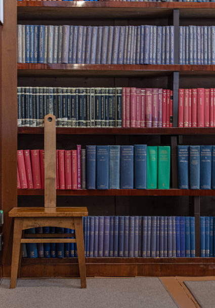  stack of books and a book in a library, National Library of Finland - 写真・画像