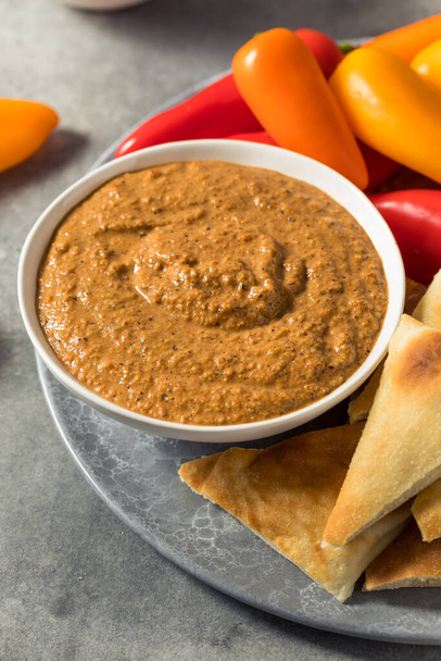 Healthy Homemade Muhammara Dip with PIta and Peppers - 写真・画像