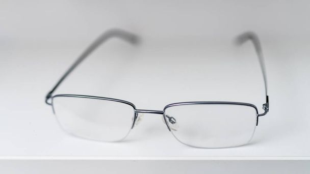Modern eyewear glasses close up view. Eyesight stylish accessory. - Fotó, kép