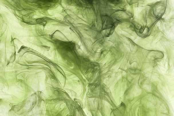 Green smoke abstract background, acrylic paint underwater explosion - Foto, imagen
