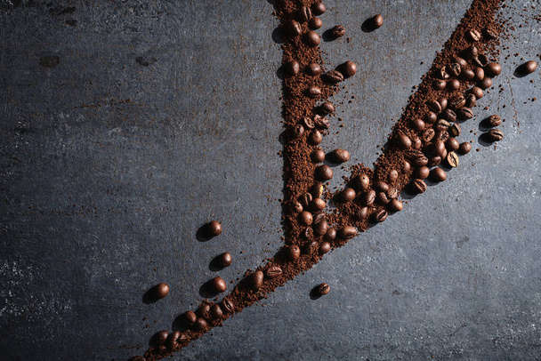 Roasted coffee beans on gray background - Fotografie, Obrázek