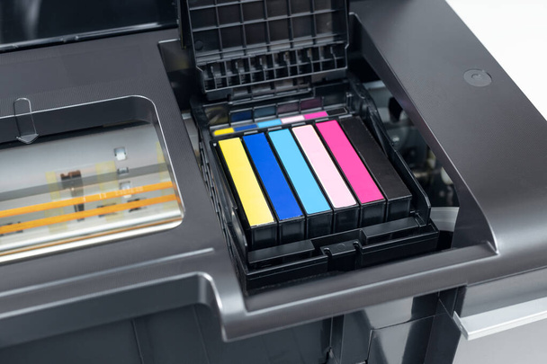 Close up of a multicolor ink cartridges of a inkjet printer. Cartridges change concept - Foto, Imagem
