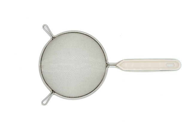 Metal sieve with white plastic handle isolated on white background. Top view. - Foto, Bild