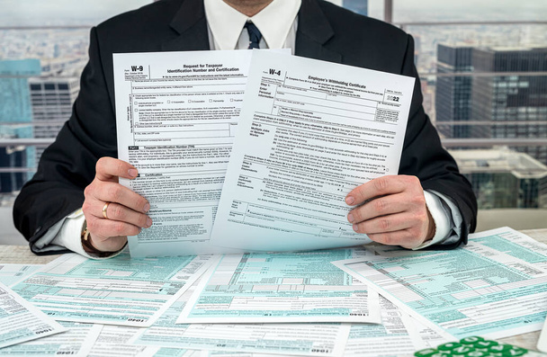 man wear suit filling tax form, business concept - Fotoğraf, Görsel