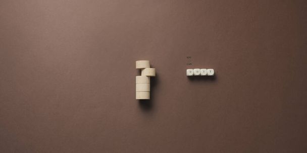 Stack of wooden cut circles with a you can do it sign on wooden dice next to it. Over brown background. - 写真・画像