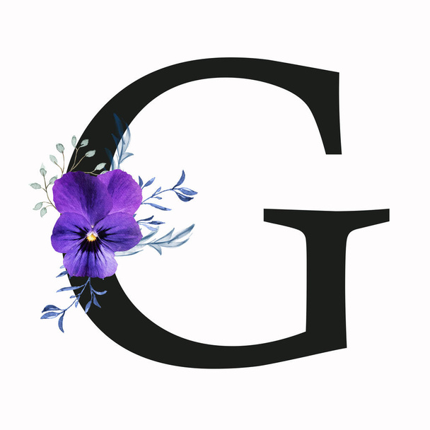Capital letter G decorated with pansy flower and blue green leaves. Letter of the English alphabet with floral decoration. Floral letter. - Photo, Image