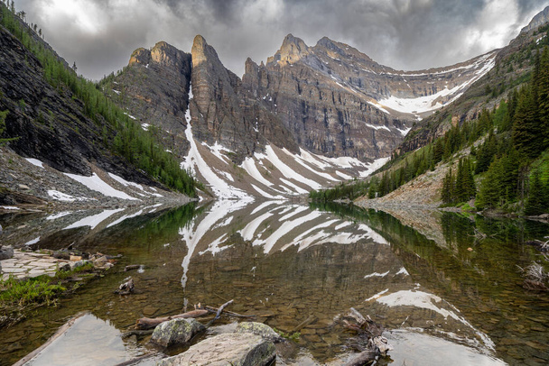 Lake Agnes in the Lake Louise area of Banff National Park, reached via hiking. Calm water in the morning - 写真・画像