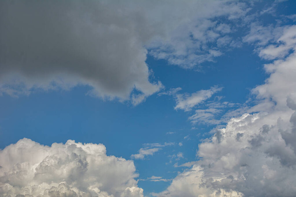 Photo of some white whispy clouds and blue sky cloudscape .Beautiful blue sky and white fluffy clouds . - Zdjęcie, obraz